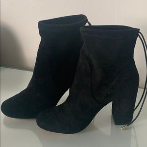 Steve Madden raver black heel boots.